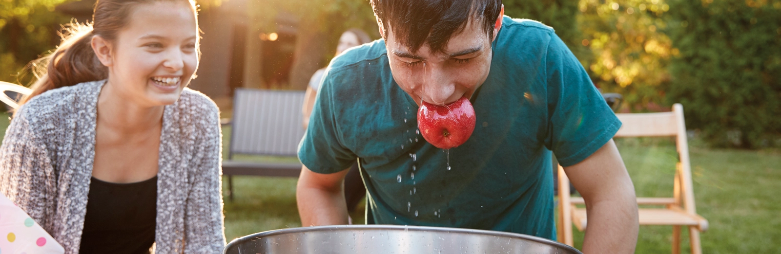 man-bobbing for apples-1600x522.webp