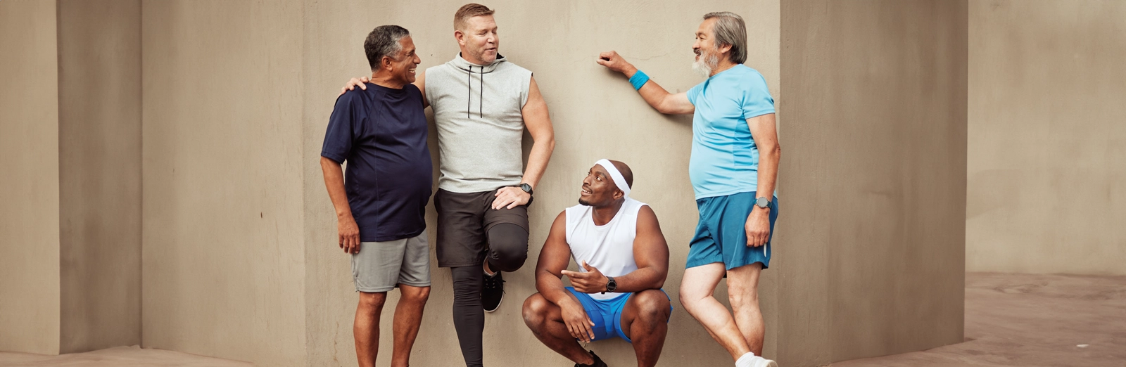 four-men-talking-1600x522-2.webp